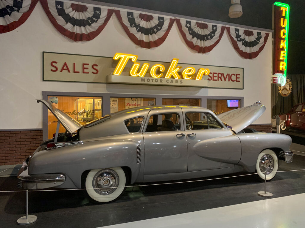 Antique Tucker automobile in front of a recreated Tucker dealership at the AACA Museum