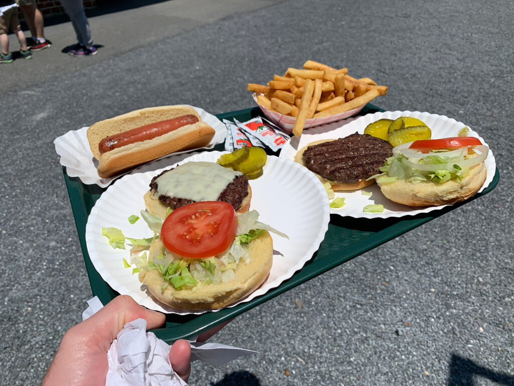 Tray of food including two burgers, fries and a hot dog