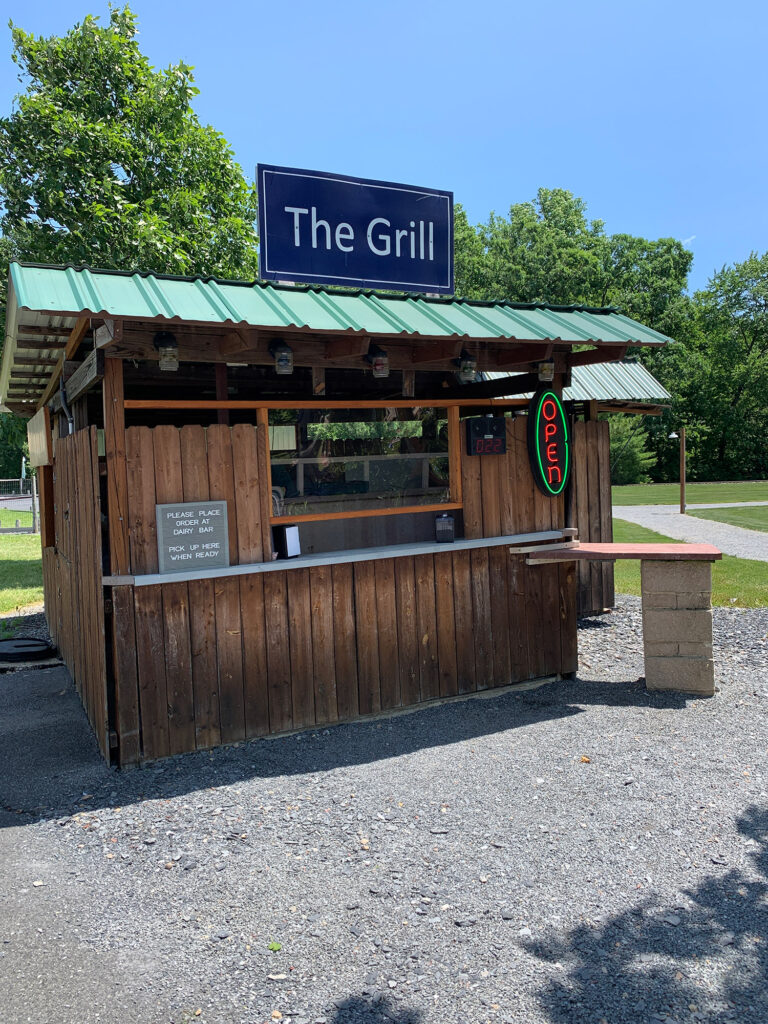 Small shack with the words "The Grill" on a sign above