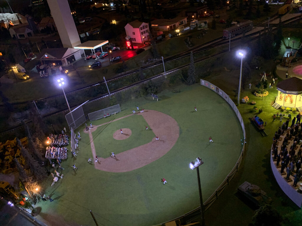 Illuminated scale model baseball stadium during the night scene at the Choo Choo Barn