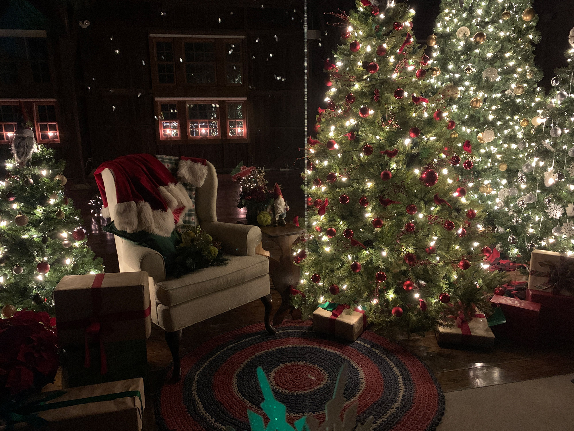 A small living room set up with a chair and Christmas tree at Gring's Mill