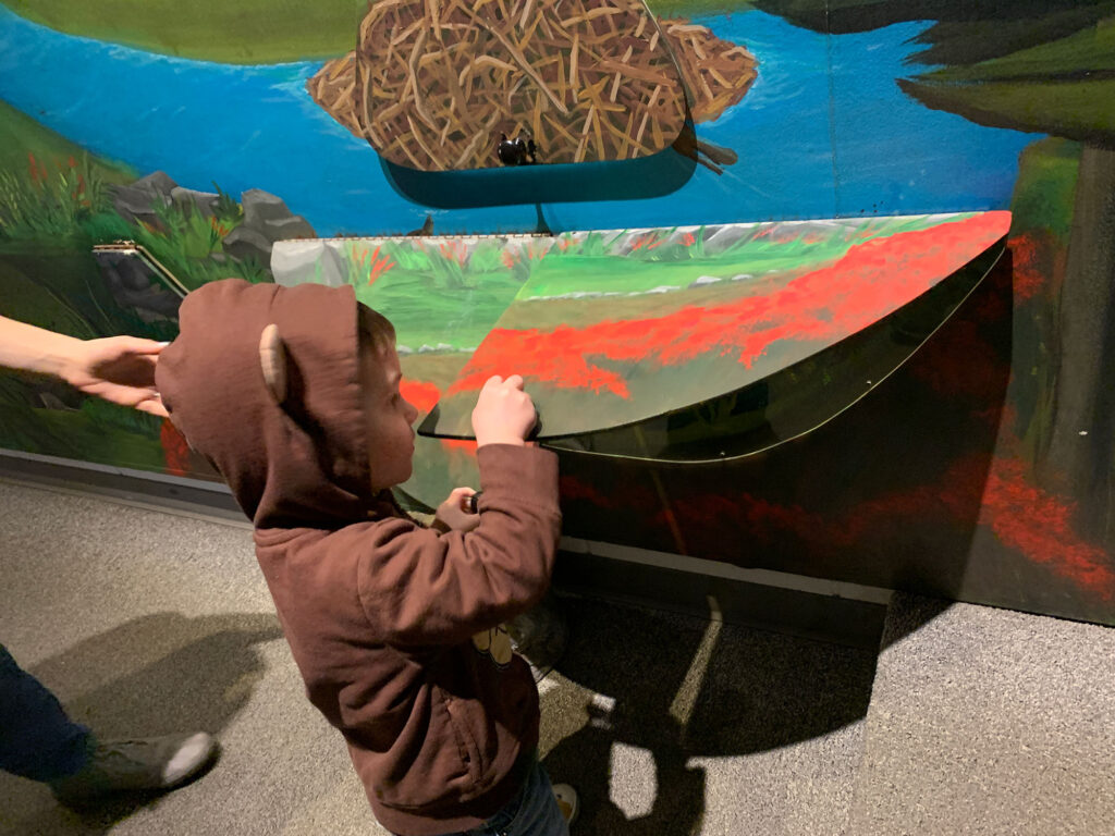 Child playing at a table at the Hands-On House in Lancaster PA