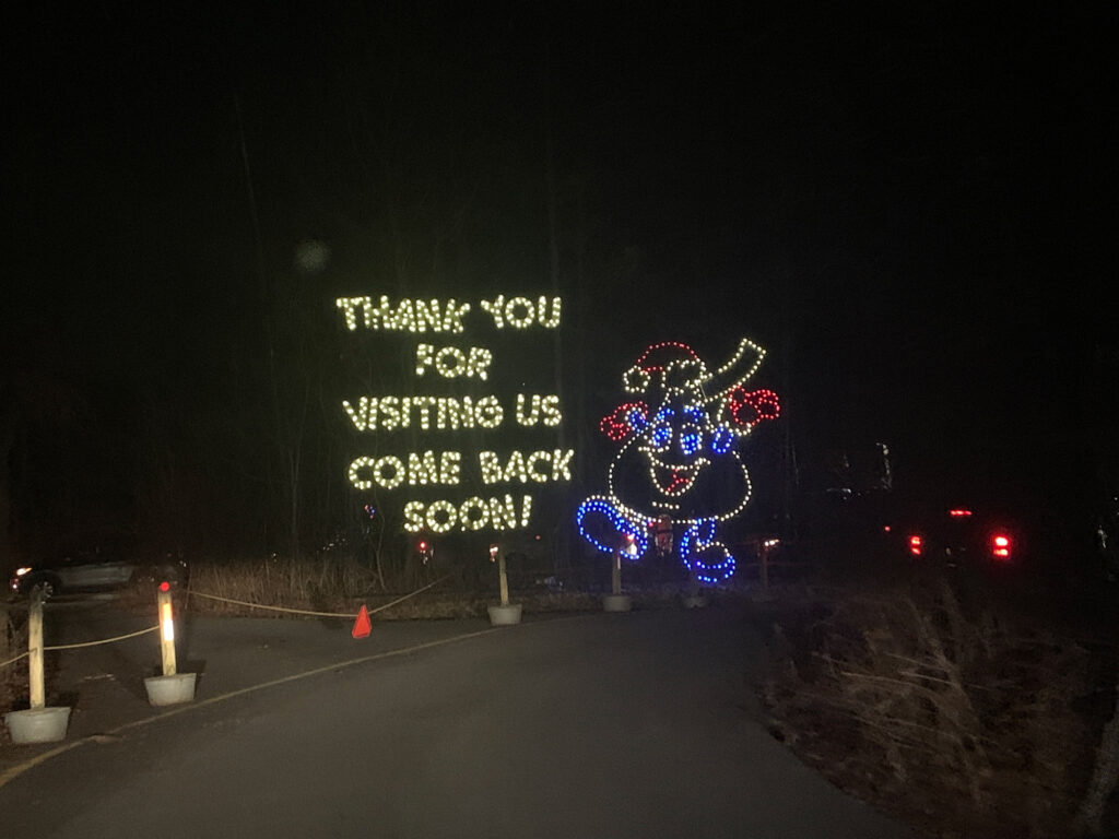 Christmas lights in the shape of a Hershey kiss and the words "Thank you for Visiting Us Come Back Soon"