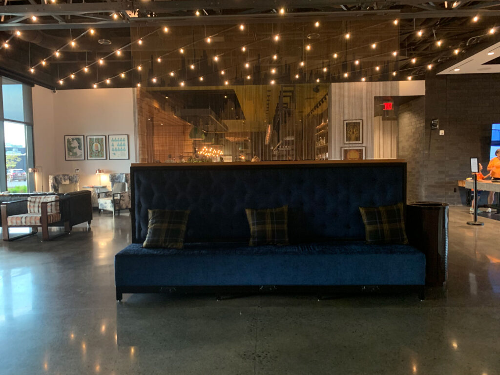 blue couch in the lobby of Hotel Rock Littiz