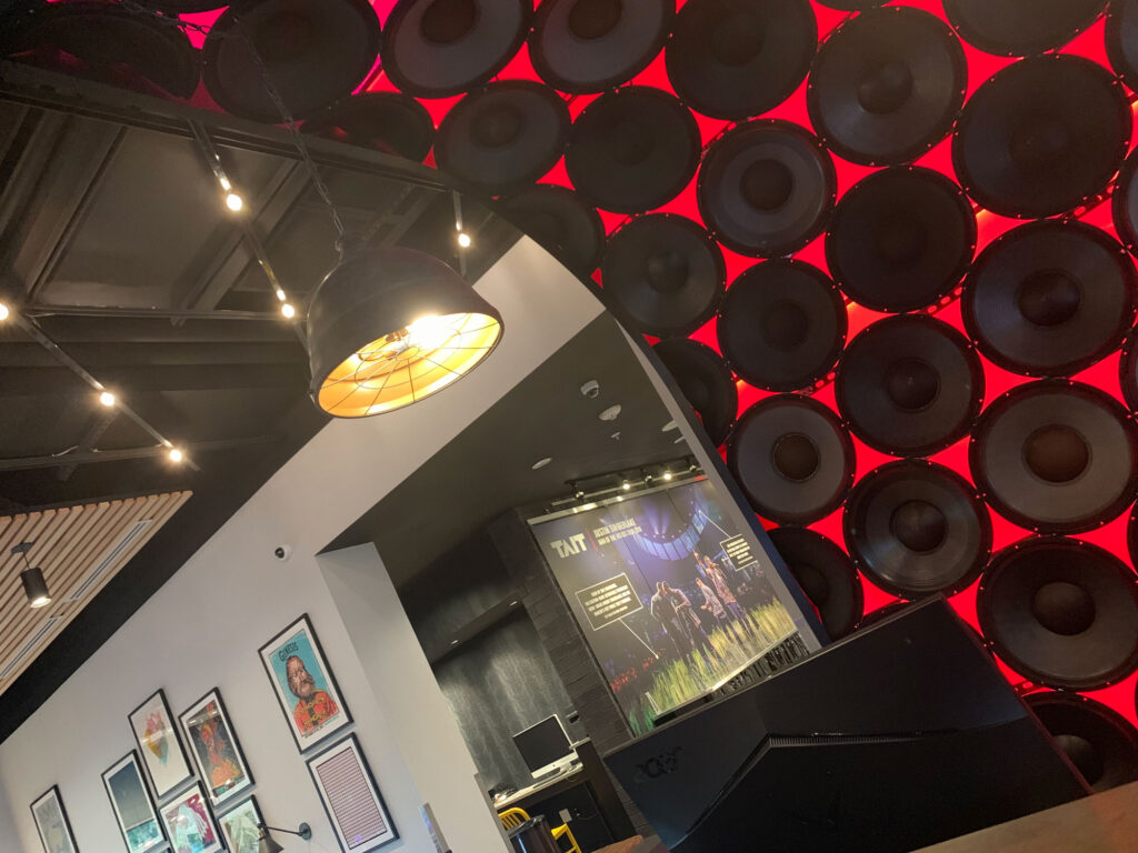 speakers backlit in red behind the check-in desk at the Hotel Rock Lititz