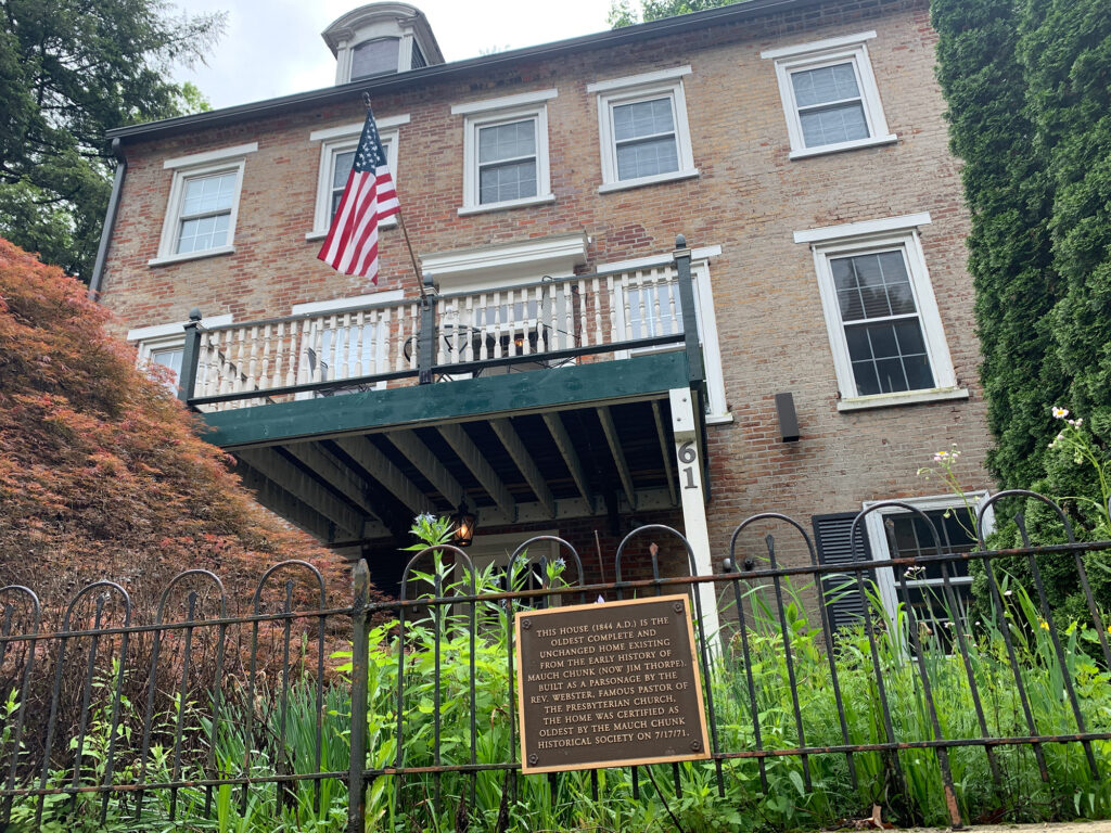 Home on a hillside of Jim Thorpe with historical marker