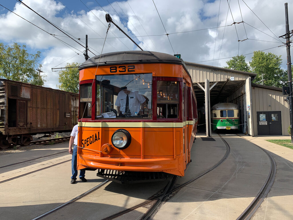 orange streetcar outside the Pennsylvania Trolley Museum