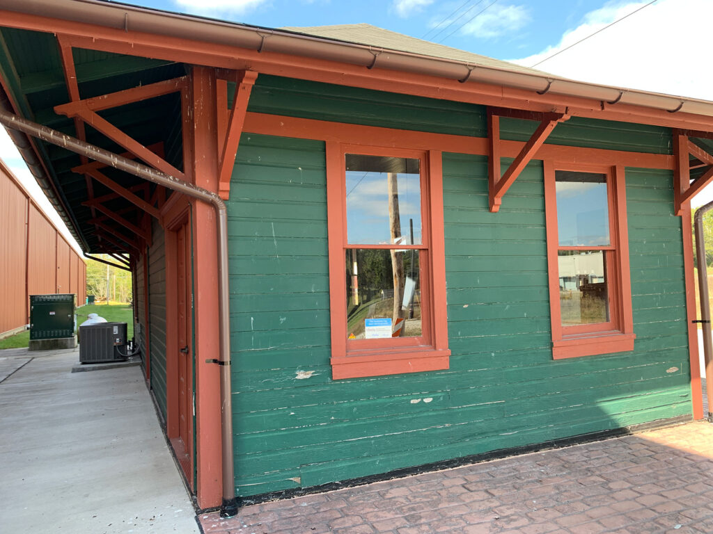 Vintage trolley station painted green with red trim at the Pennsylvania Trolley Museum