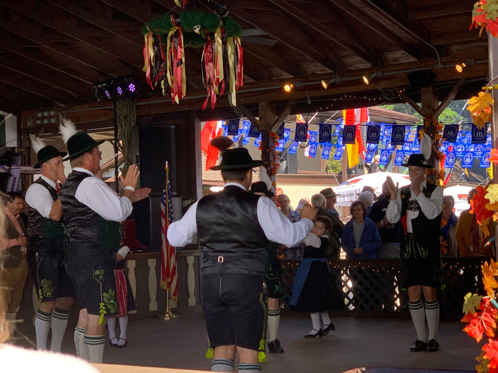 dancers in traditonal German garb form a circle