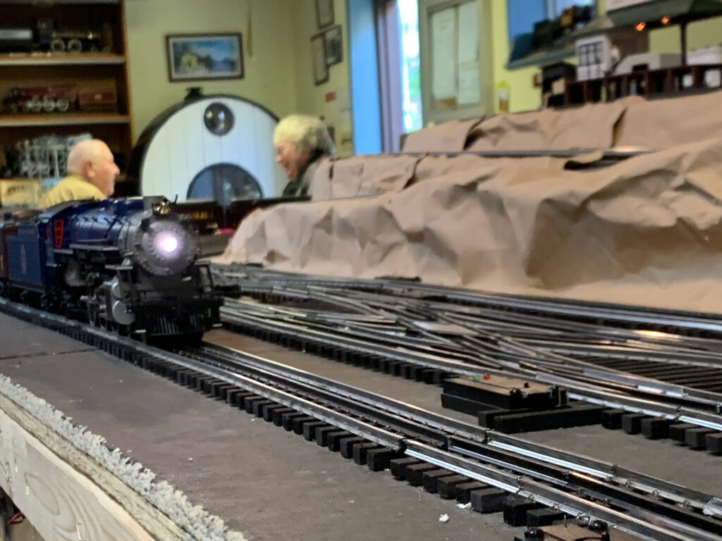 Model train on table coming toward camera