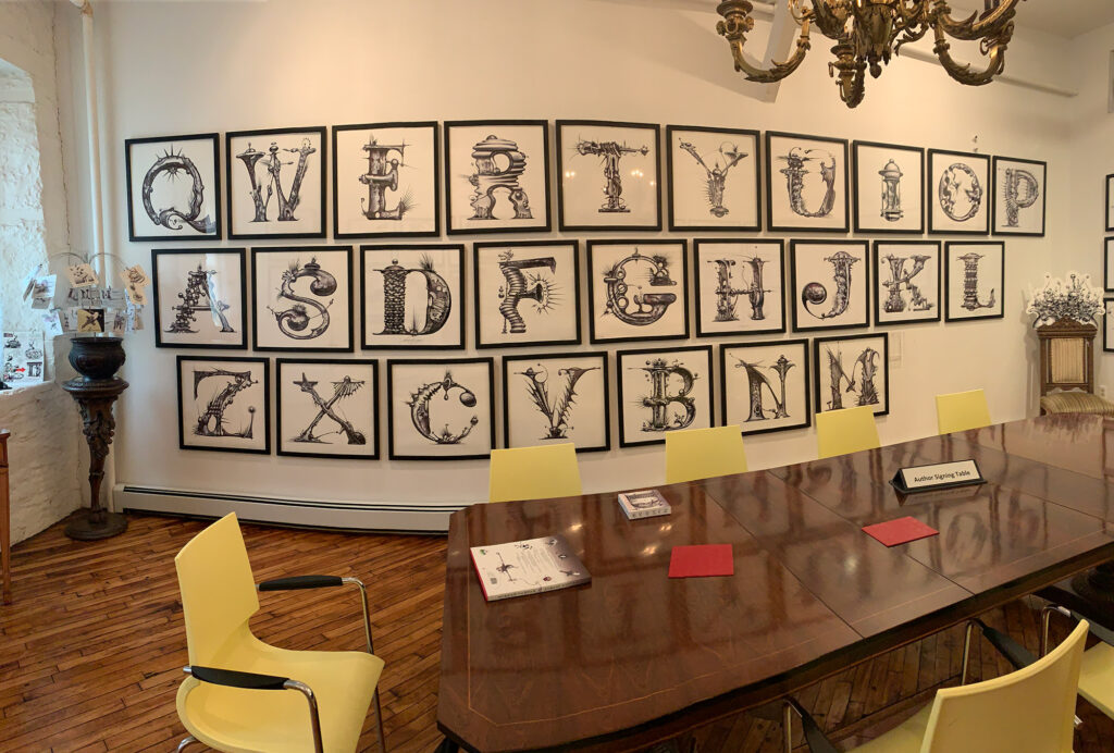 whimisically designed letters individually framed and ordered like a QWERTY keyboard 