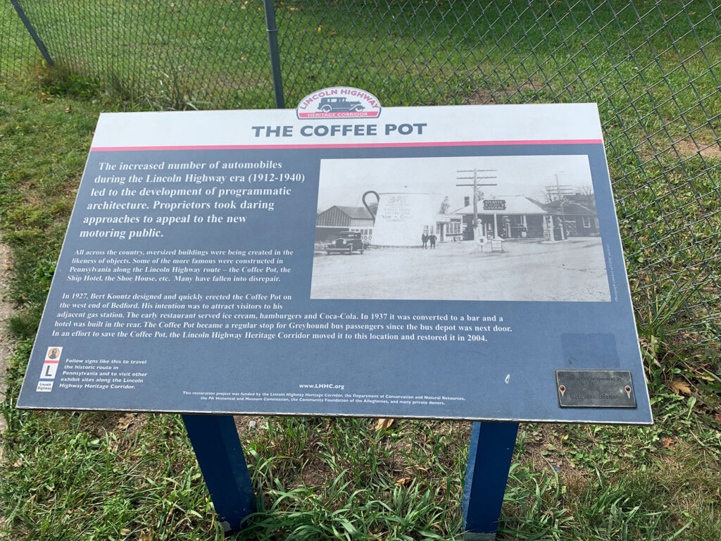 Informational plaque in front of the Coffee Pot roadside attraction in Bedford PA