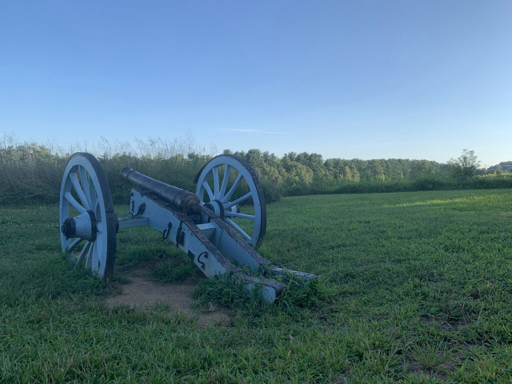 Revolutionary War era cannon sits in a field at Valely Forge Park