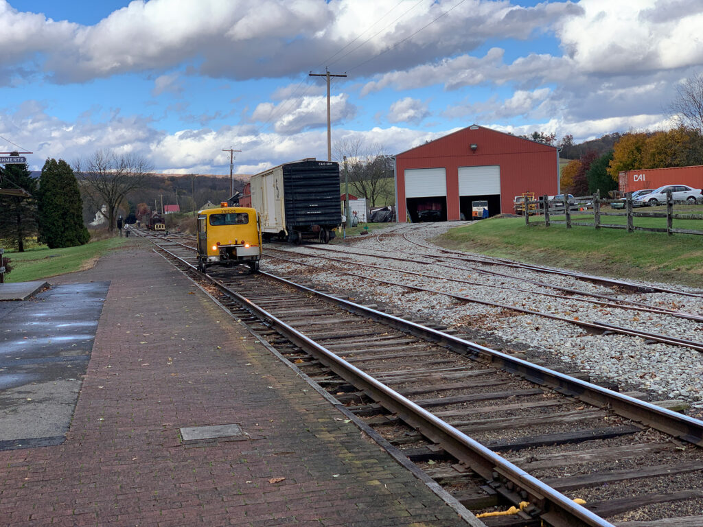 Speeder car drives through the yard at the Wanamaker Kempton and Southern Railroad