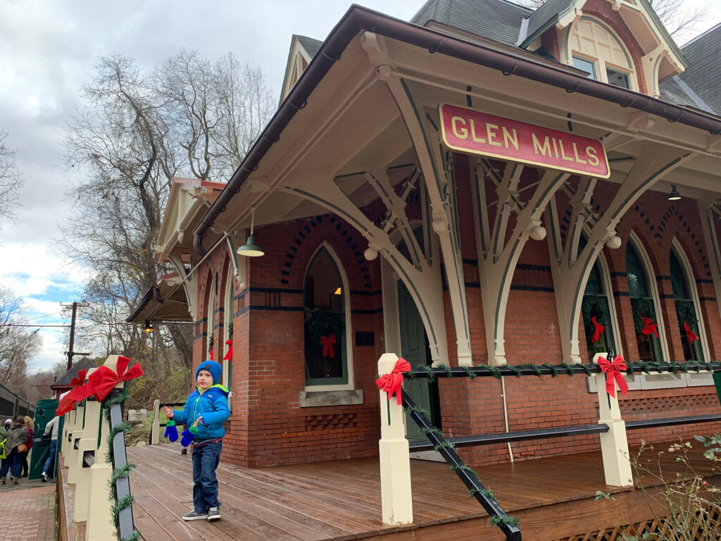 historic brick train station with sign reading "Glen Mills"