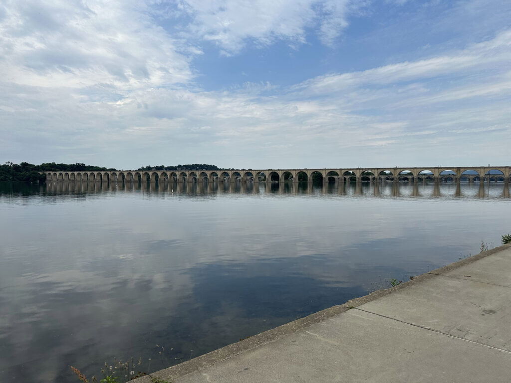 View of the Susquehanna River and a stone arch bridge from Harrsiburg, PA