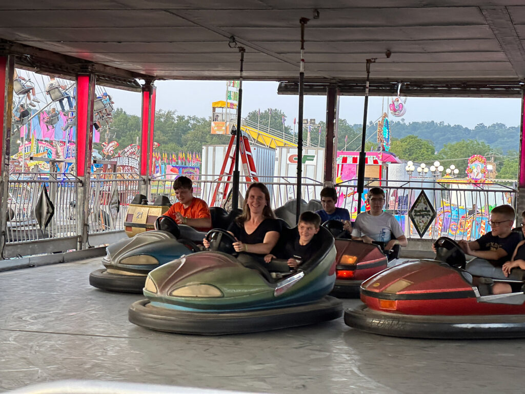 woman and child ride in a bumper car at the Bedford County fair