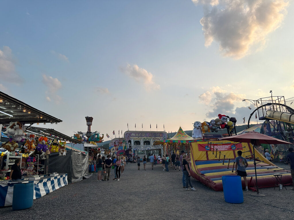 Row of fgames and a bounce climber at the Bedford County Fair