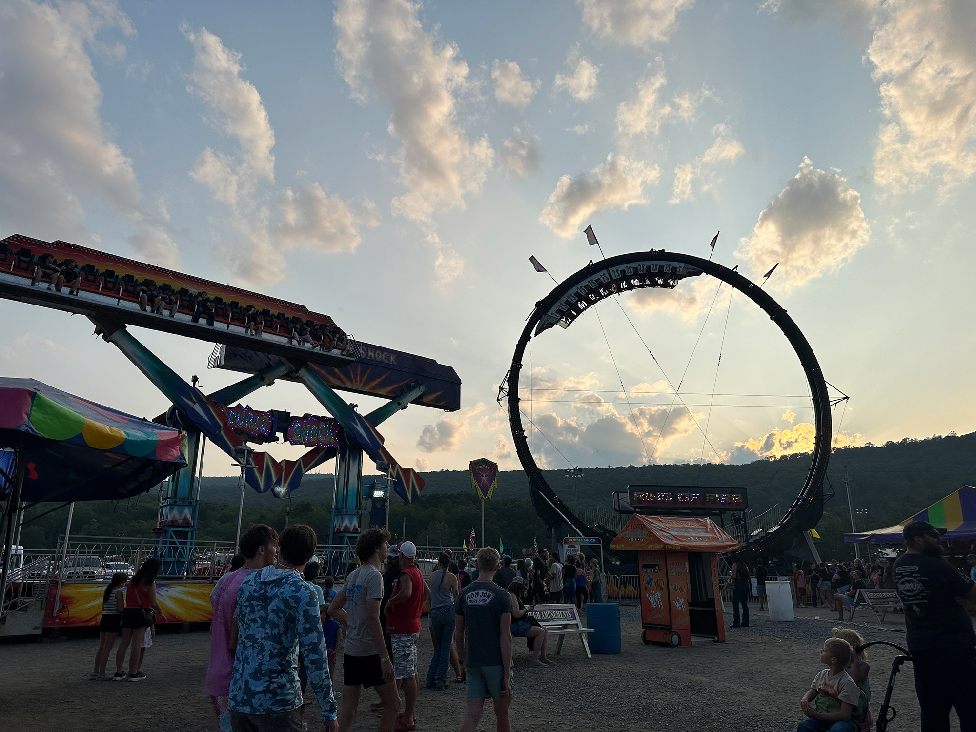 Midway rides at twilight at the Bedford County Fair