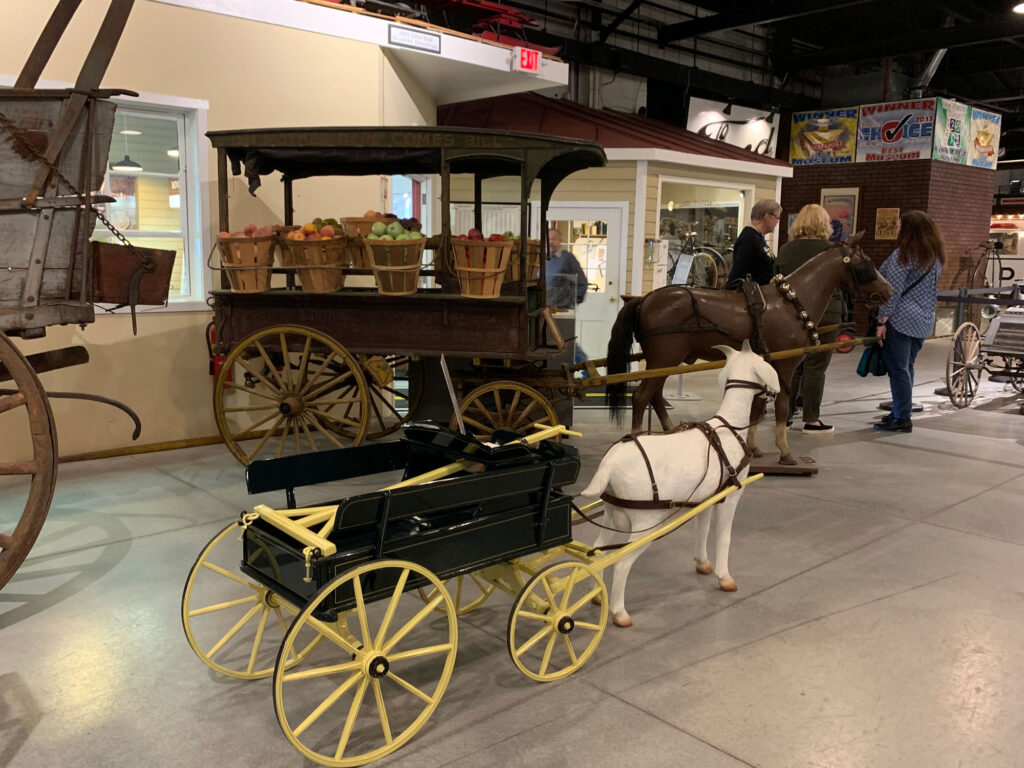 statue of a mini horse pulling a wagon at the Boyertown Museum of HIstoric Vehicles