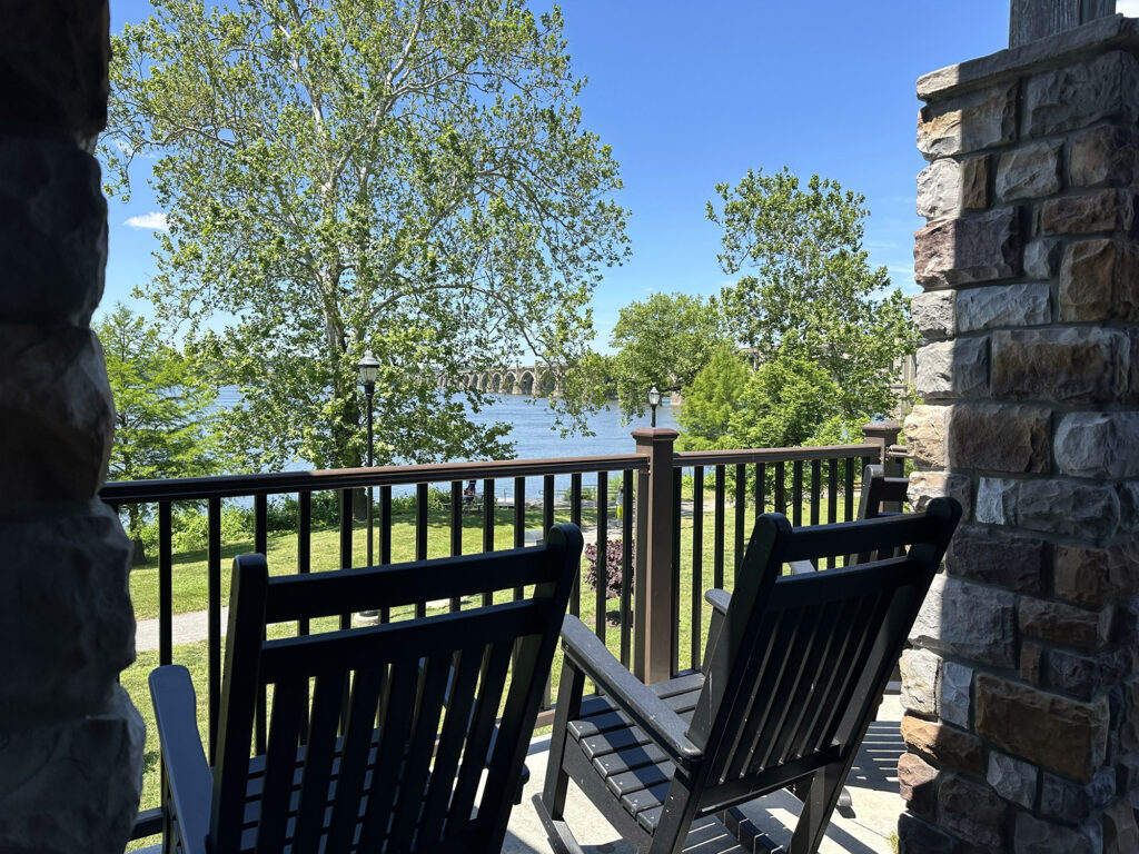 rocking chairs on a deck overlooking the Susquehanna River at Columbia Crossings