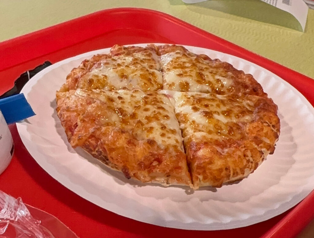 pizza on a red tray at the Crayola Experience