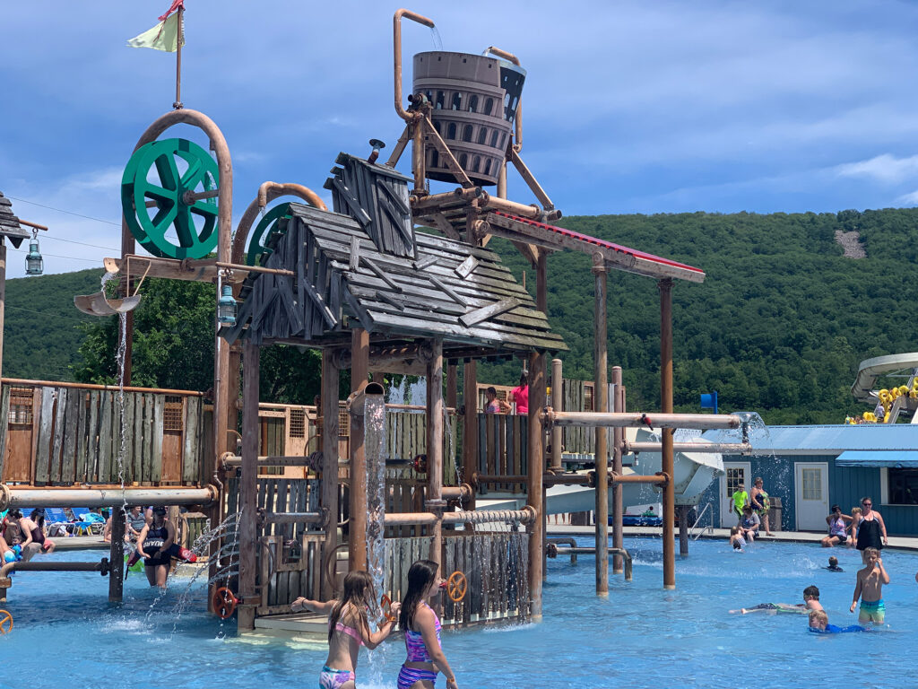 Play area at Laguna Splash at Delgrosso's featuring a giant wine bucket that dumps water