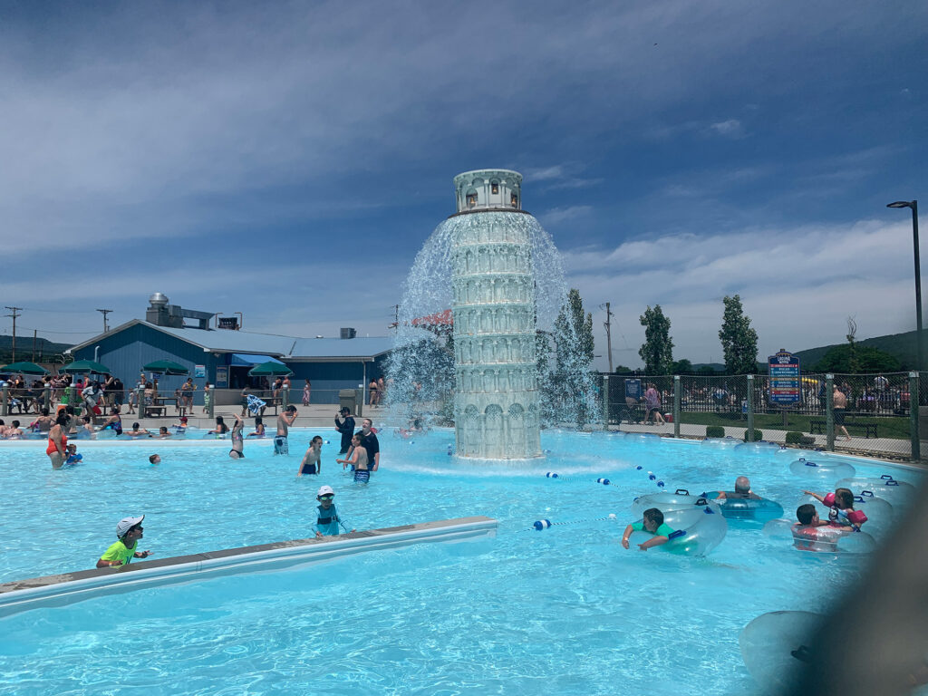 kids splash around a replica of the Leaning Tower of Pizza spewing water at Laguna Splash at Delgrosso's Amusement Park