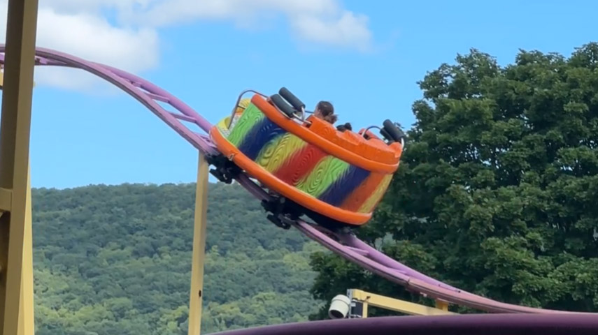 Spinning multi-colored car on the crazy mouse roller coaster at Delgrosso's Amusement Park