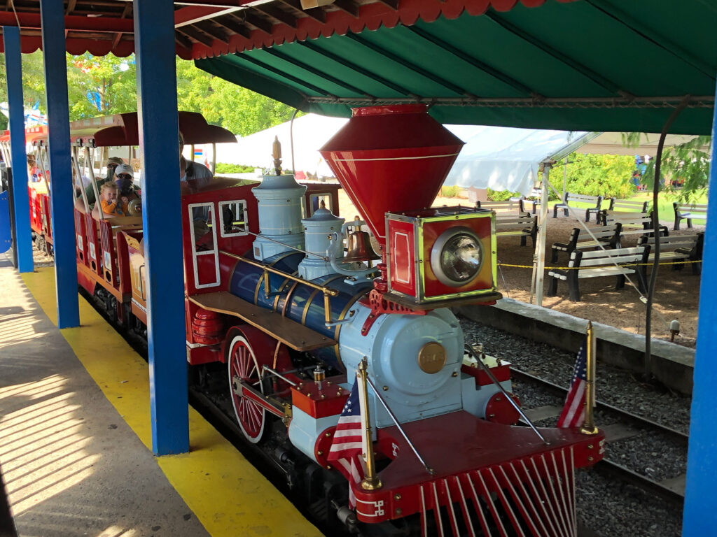 Miniature steam train parked at the loading area in Dutch Wonderland