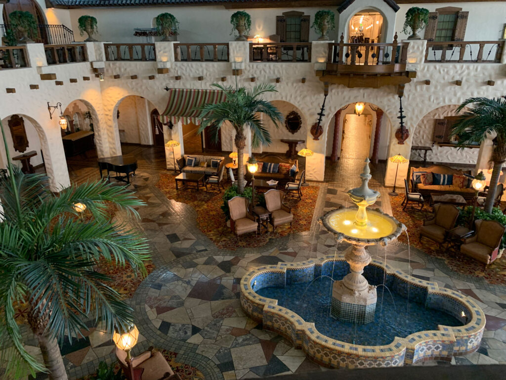 wide view of the original obby of the Hotel Hershey with tile floors and a fountain