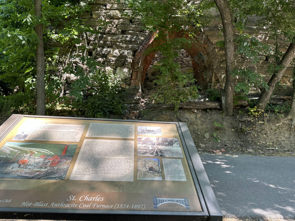 limekiln furnance barely visible through overgrown trees