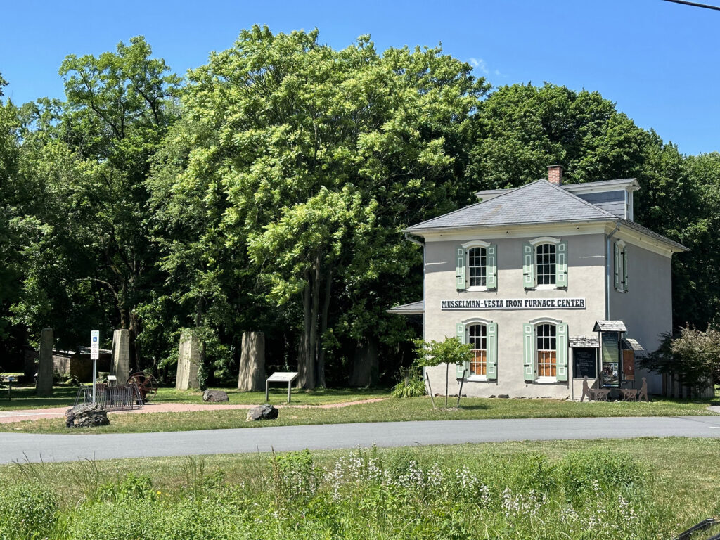 white square building with a sign reading "Musselman-Vesta Furnace"