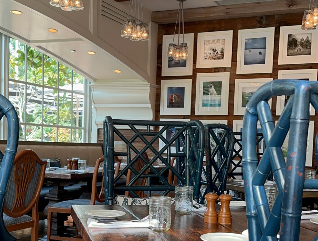 dining room with wall lined with pictures of dogs at the White Dog Cafe in Wayne, PA