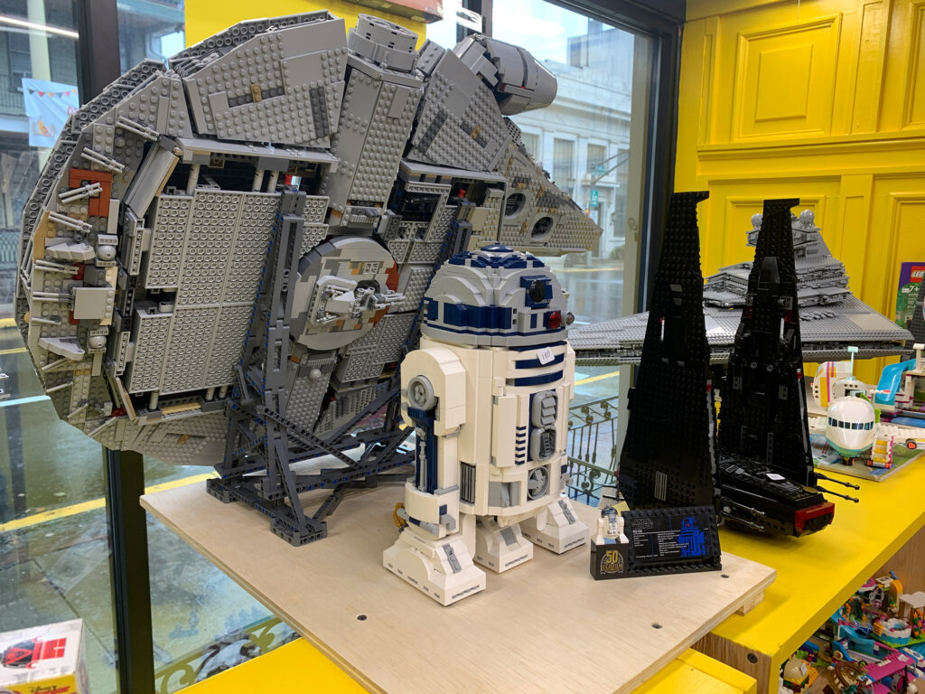 LEGO models of the Millenium Falcon and R2D2 on the shelf at Boyertown Brickworks