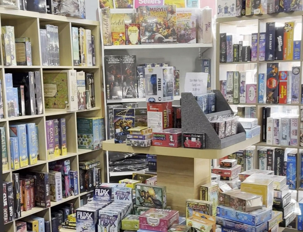 shelves full of board games at Deal Me In Games in Boyertown