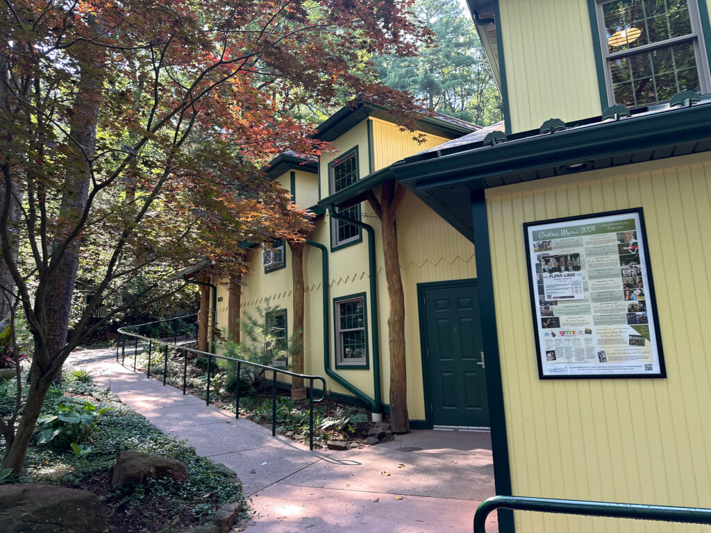 Facade of the Mt Gretna Playhouse with yellow wood and dark green accents