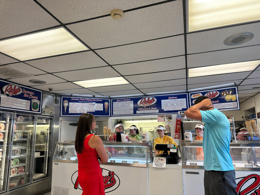 Customers stand at the ice cream counter at Ritchey's Dairy