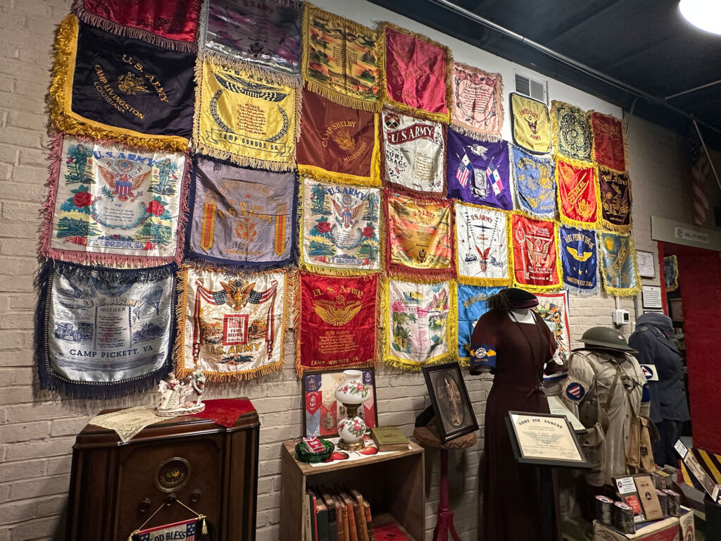 Wall with silk banners representing various units military units
