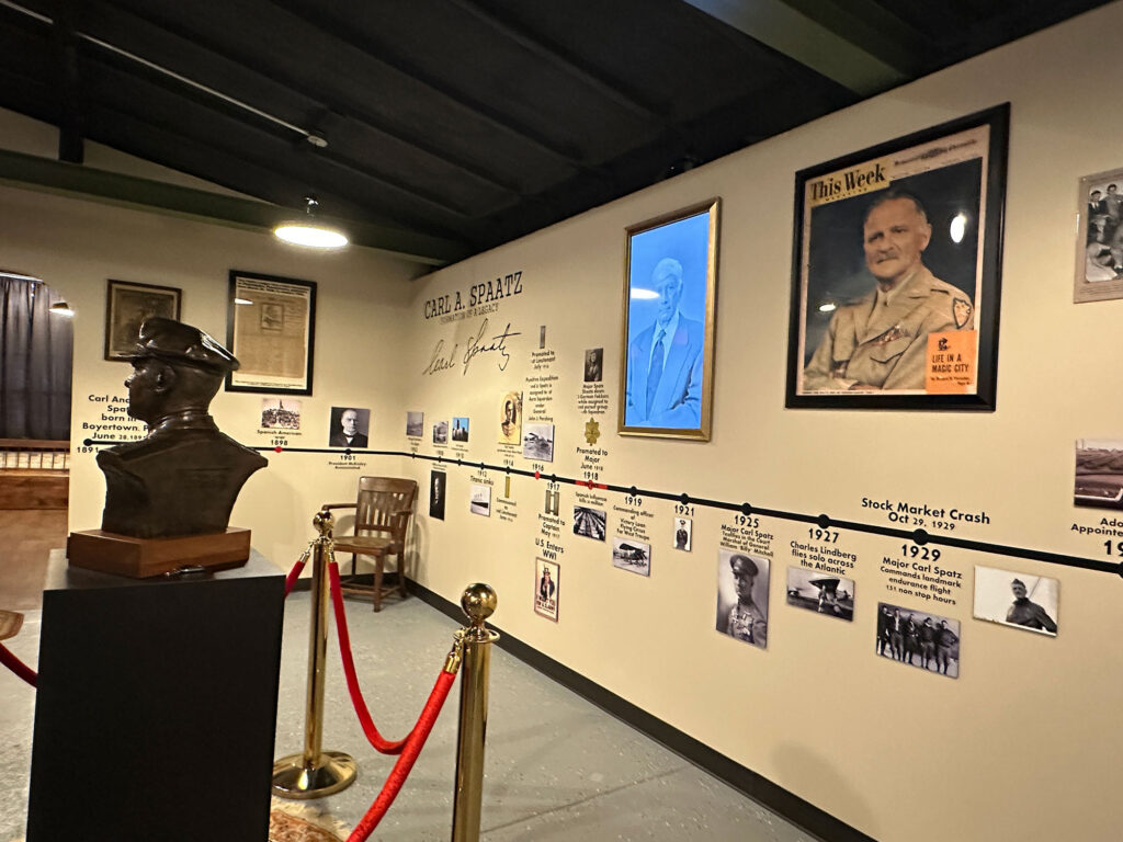 room with yellow walls and a timeline that stretches around the center of the walls