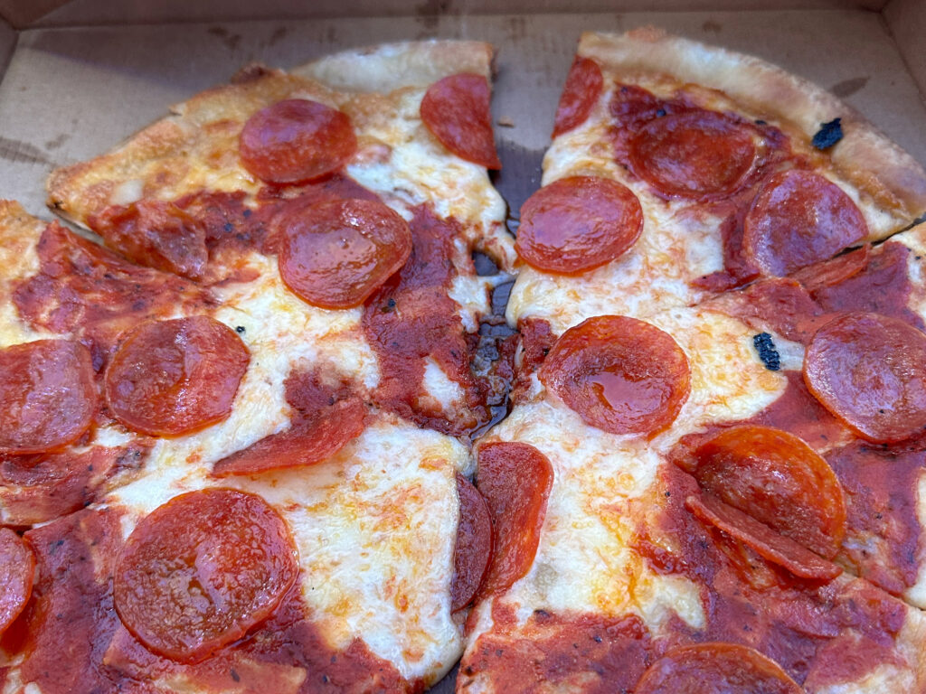 pepperoni pizza in a cardboard box