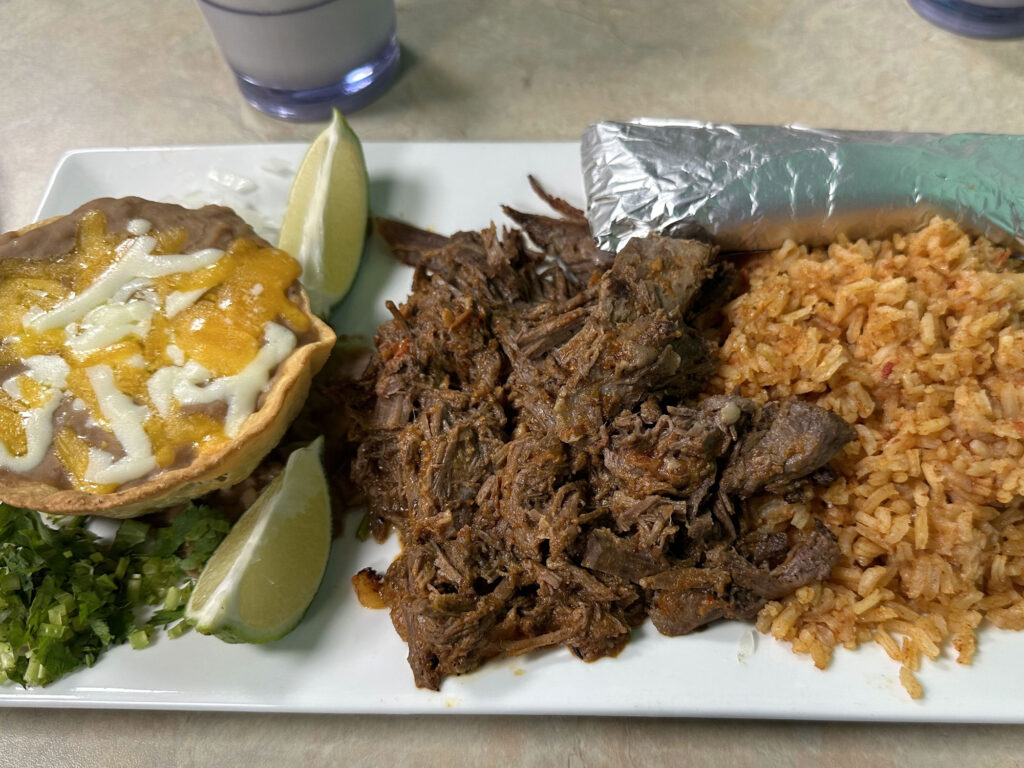 plate with refried beans, pulled beef, and yellow rice from Los Agaves in Wellsboro
