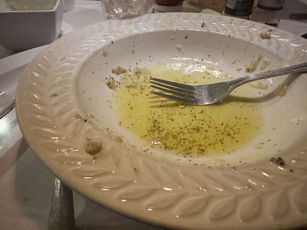 empty pasta bowl with oil settled in the bottom