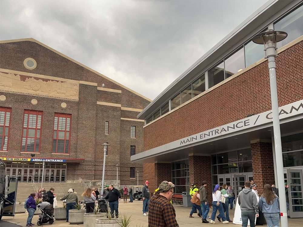 two brick buildings - one an old barn-shaped arena, the other a short-roofed building - make up the entrance of the Pennsylvania Farm Show Complex