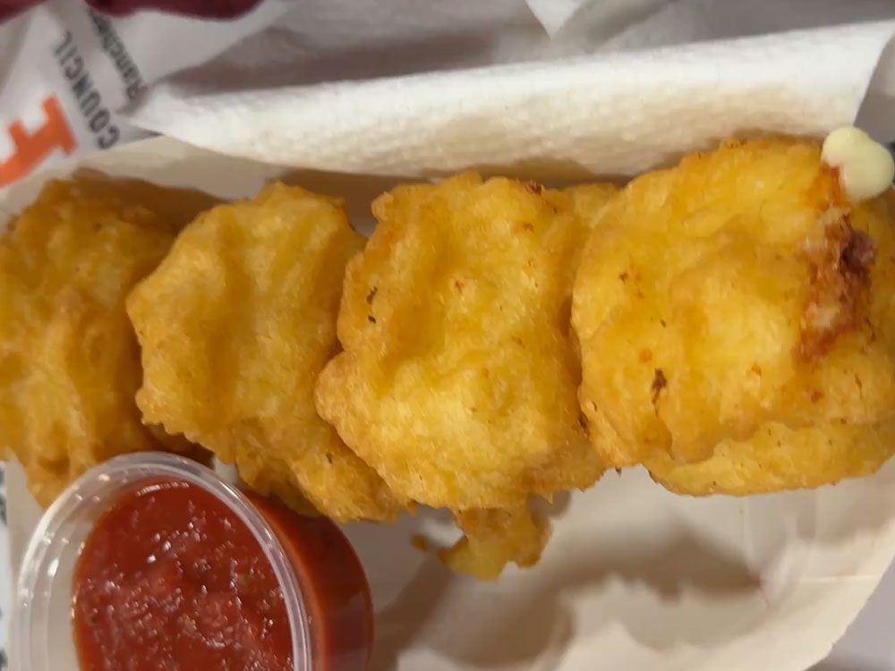 takeout boat with four cubes of fried mozzarella from the PA Farm Show