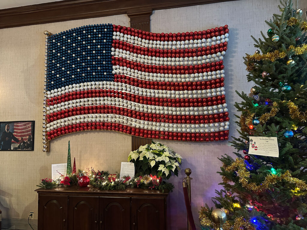 American flag made of red, white and blue glass Christmas ball ornaments. 