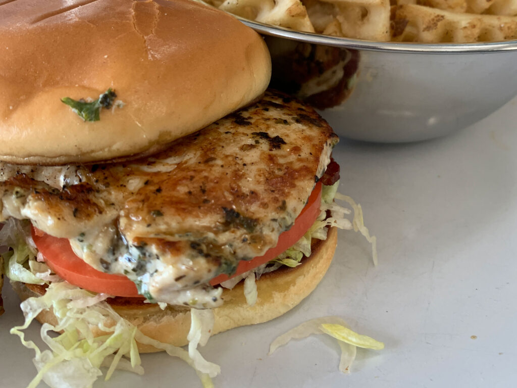 grilled chicken sandwich with lettuce, tomato, bacon and ranch dressing